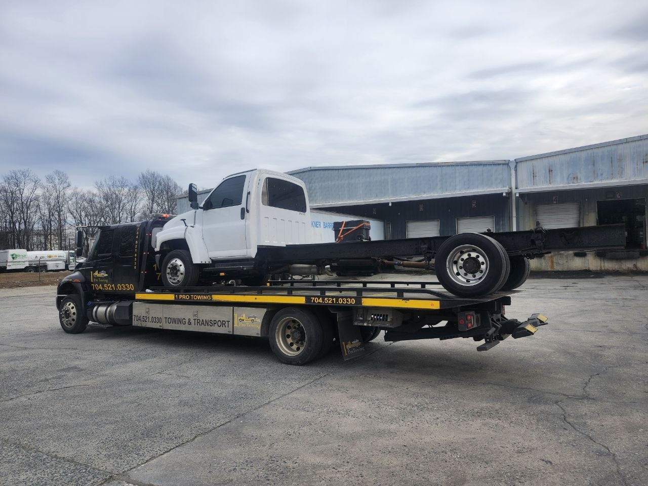 1 Pro Towing hauling a medium-duty work truck