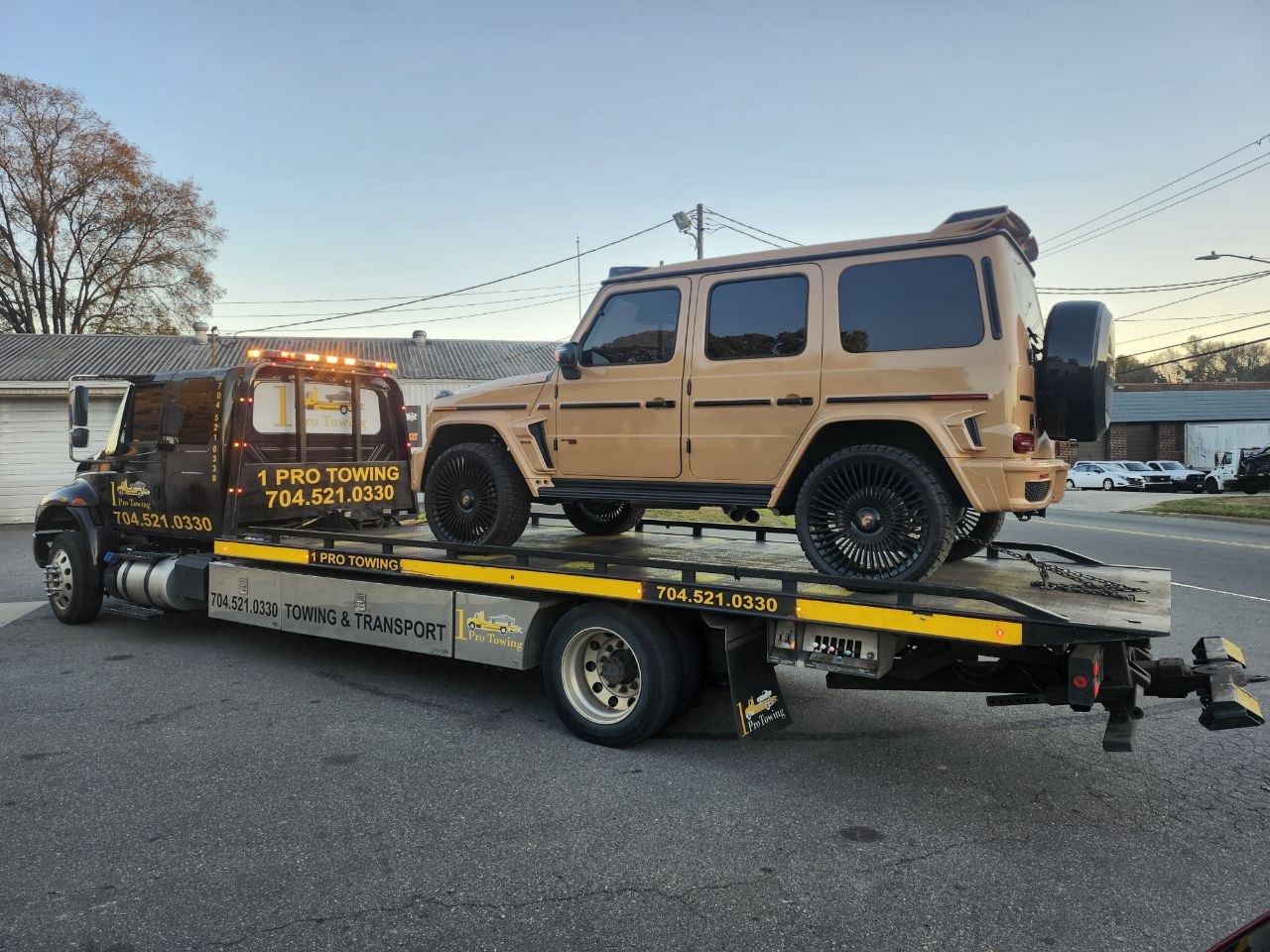 1 Pro Towing transporting a Mercedes G-Wagon SUV